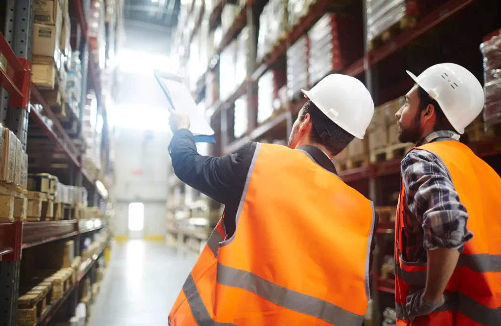 Storehouse Logistics workers looking at shelves